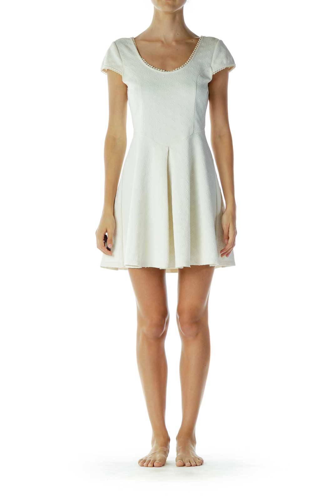 Front view of white textured cap sleeve mini dress by Free People