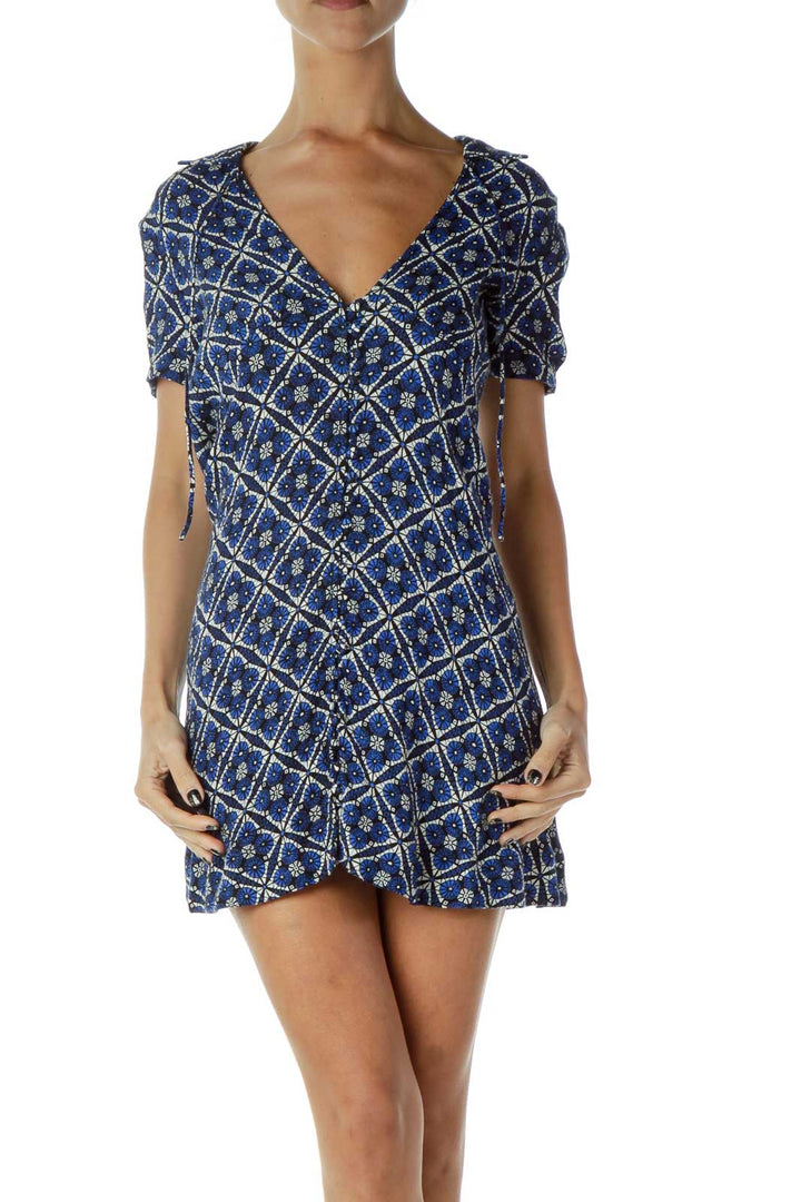 Front view of Free People blue geometric print mini dress with V-neck and short sleeves