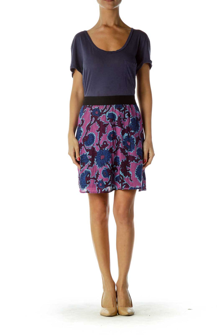 Front view of Free People dress with navy top and purple floral print skirt