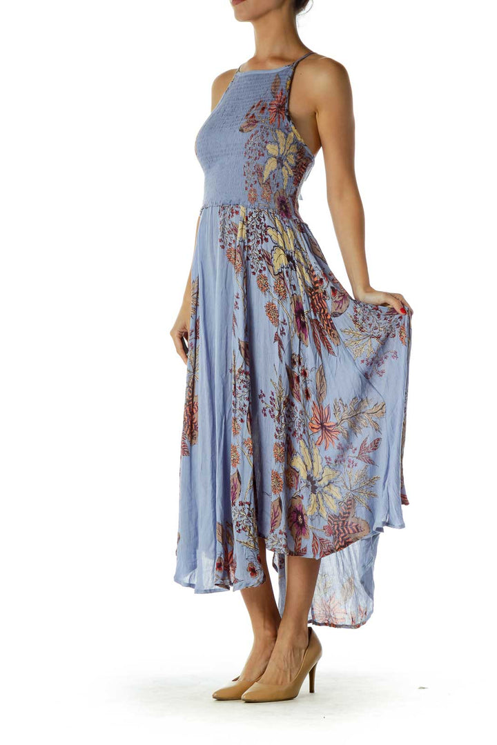 Front view of Free People blue floral maxi dress with smocked bodice