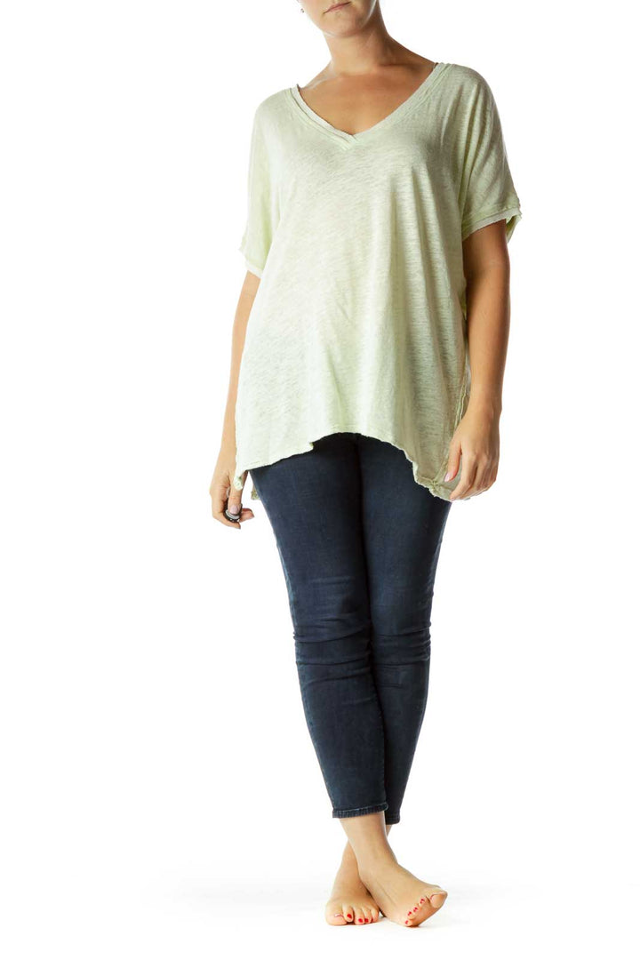 Front view of mint green oversized V-neck t-shirt from Free People