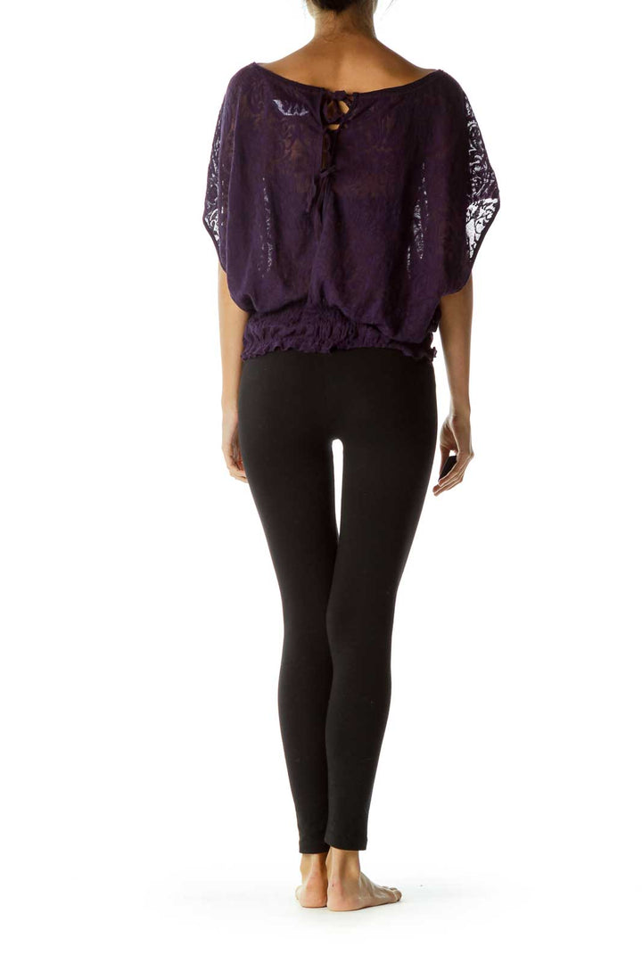 Back view of purple Free People batwing top showing tie-back detail