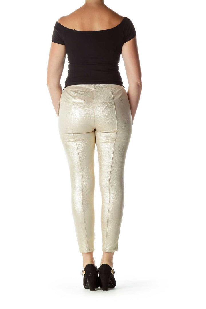 Back view of gold metallic skinny pants from Free People