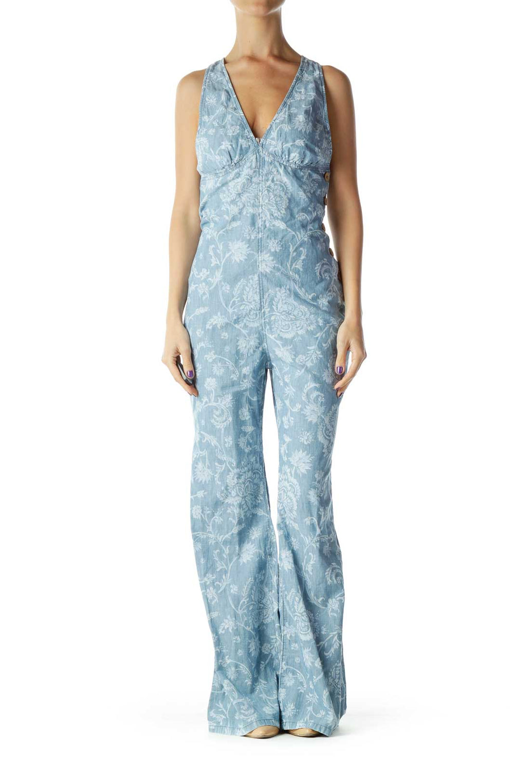 Front view of blue floral printed Free People jumpsuit with V-neck