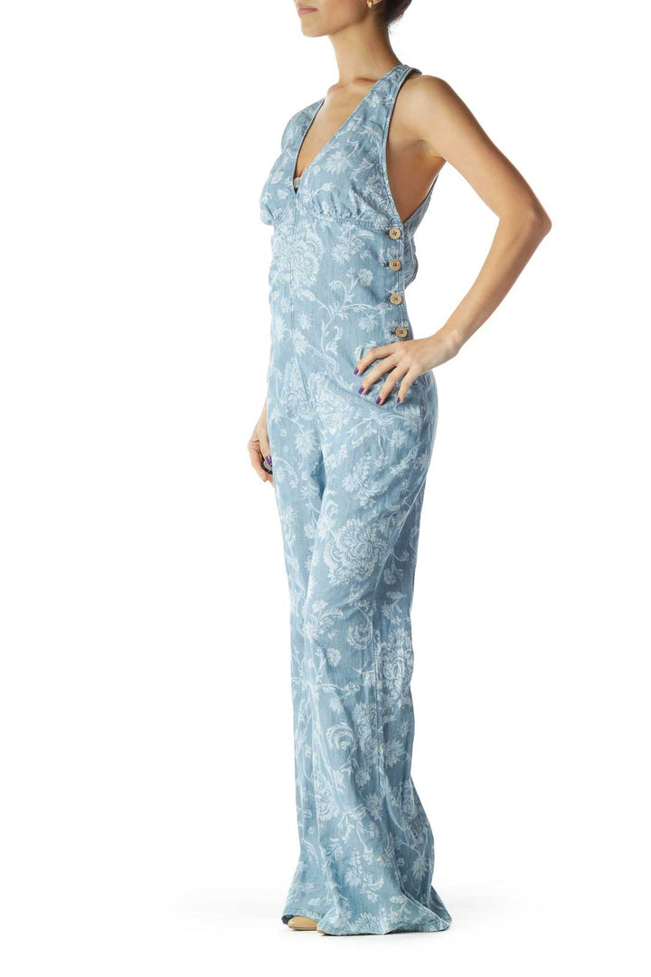 Front view of blue floral printed Free People jumpsuit with V-neck