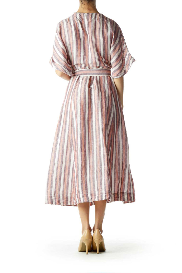 Back view of Free People pink striped midi dress showing flowy silhouette