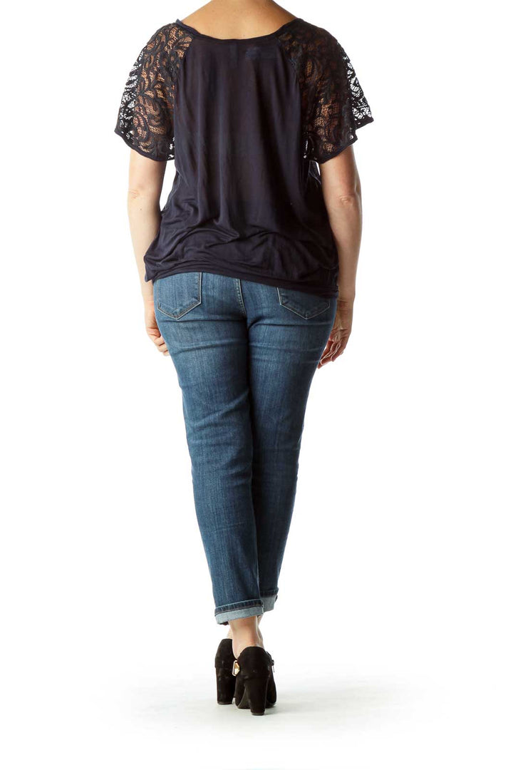 Back view of Free People navy top showing lace sleeve detail