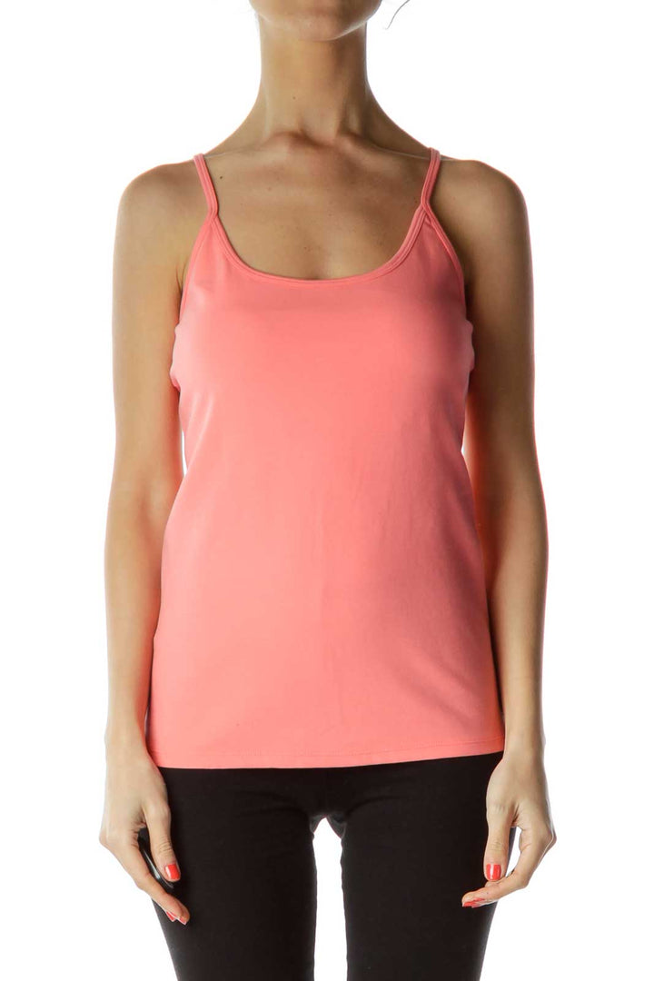 Front view of coral Free People tank top with thin straps