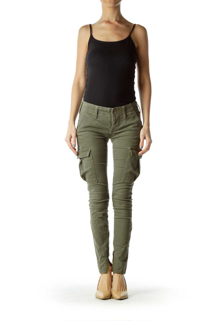 Front view of olive green slim-fit cargo pants from Free People