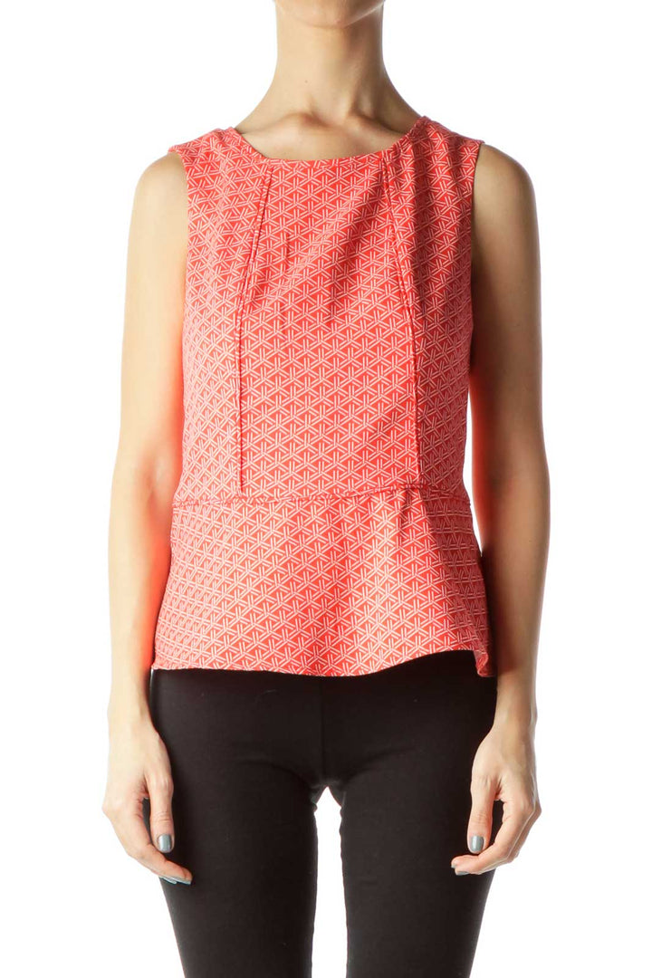 Front view of Banana Republic coral geometric print sleeveless peplum top