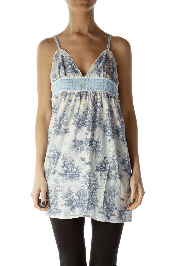 Front view of Free People blue and white floral babydoll camisole top with empire waist