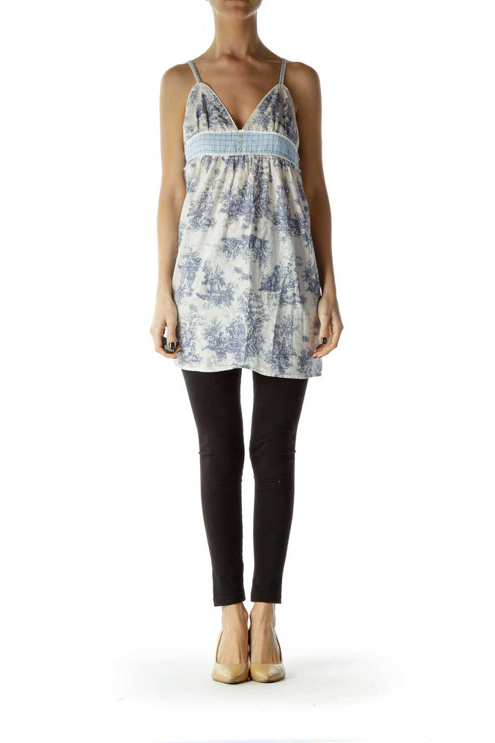 Front view of Free People blue and white floral babydoll camisole top with empire waist