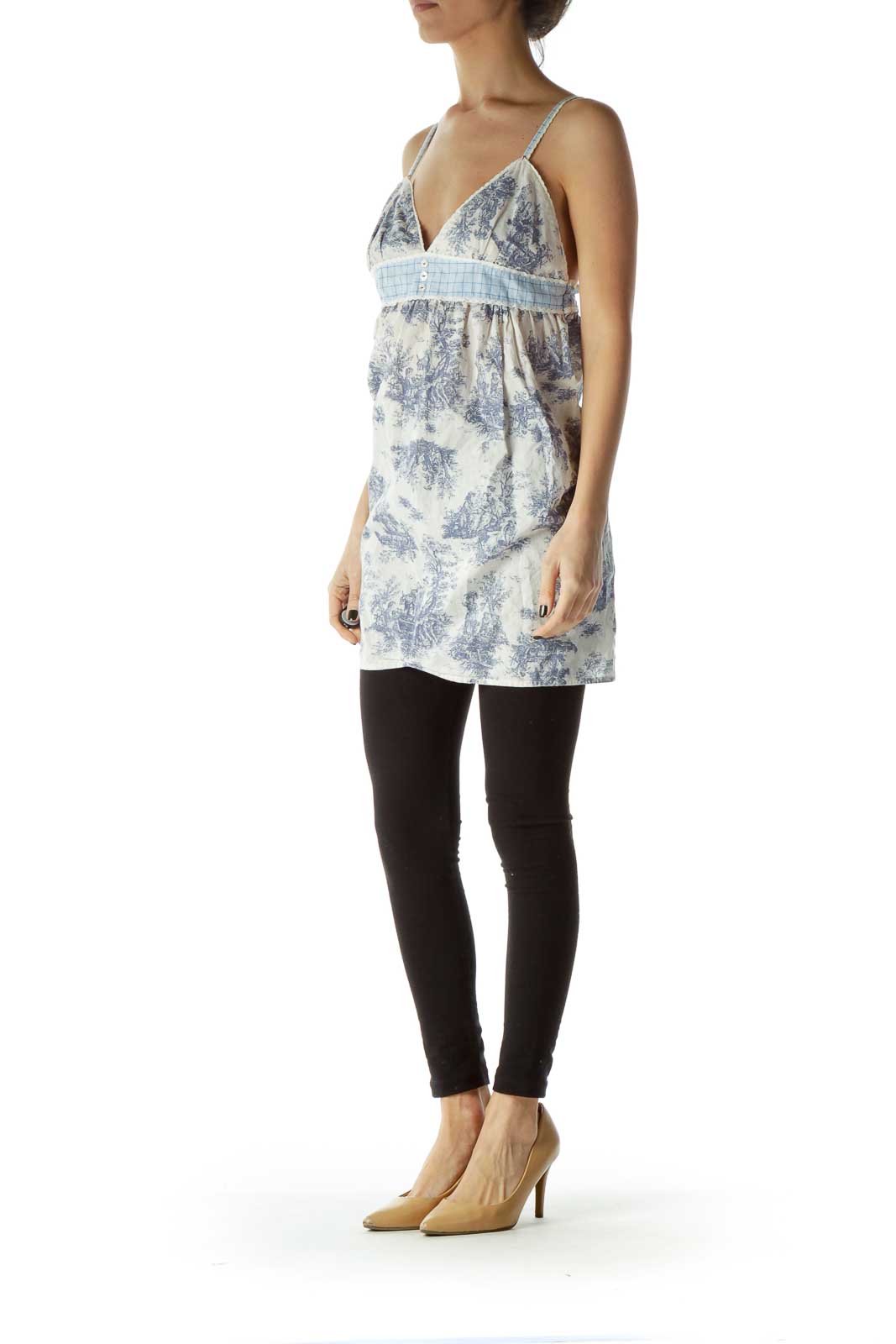 Front view of Free People blue and white floral babydoll camisole top with empire waist