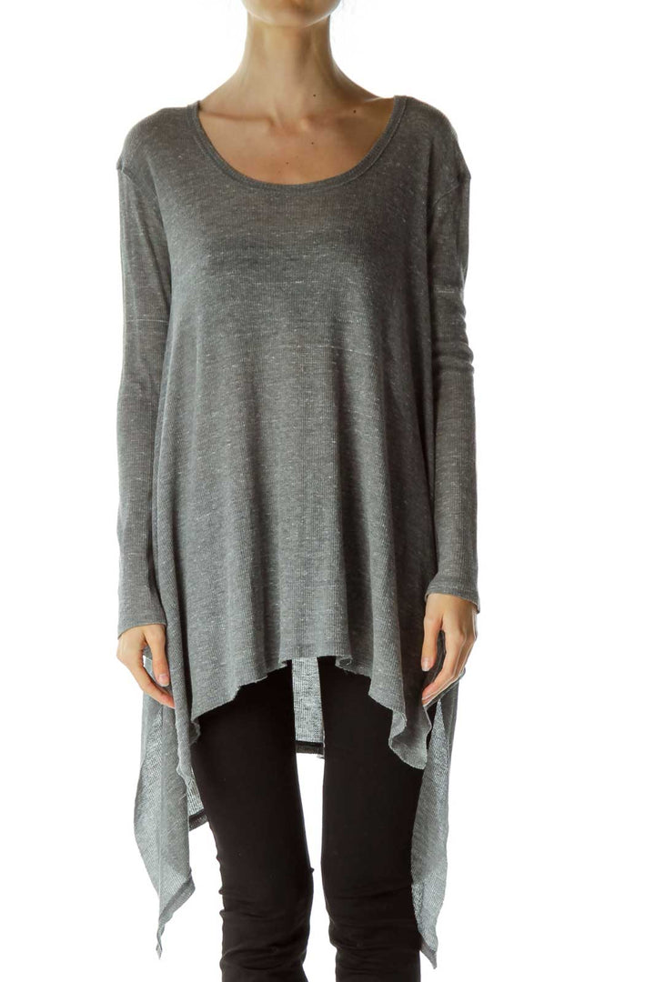 Front view of Free People gray asymmetrical flowy tunic top on model