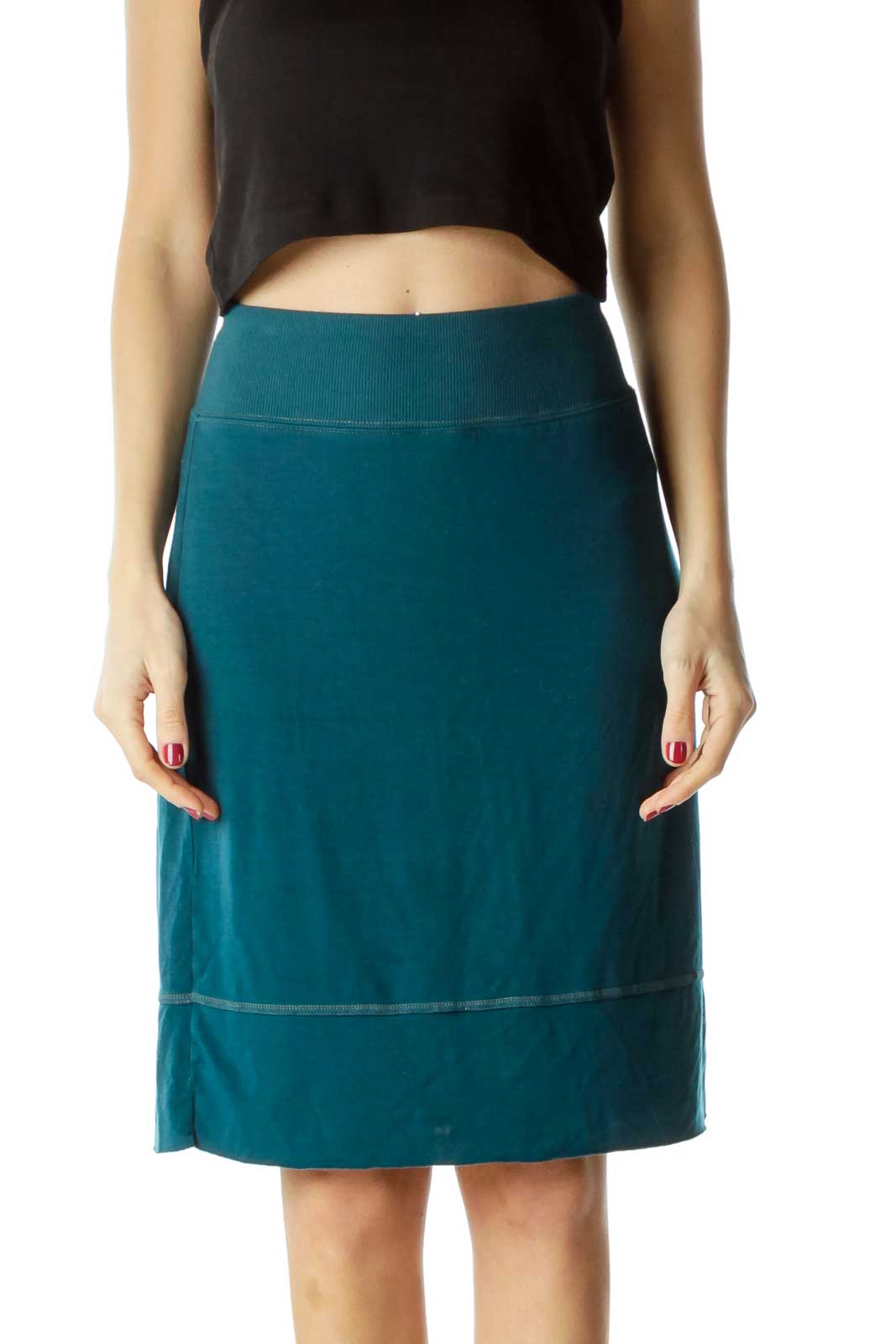 Front view of teal Free People A-line skirt on model