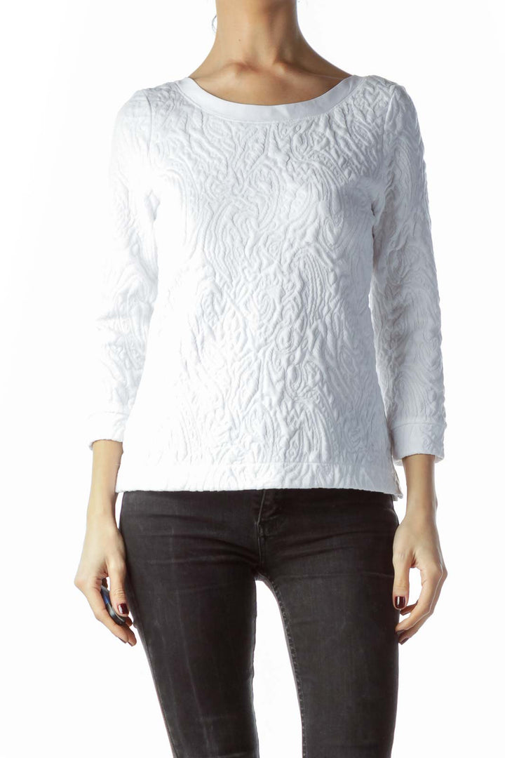 Front view of white textured Free People long sleeve top on model