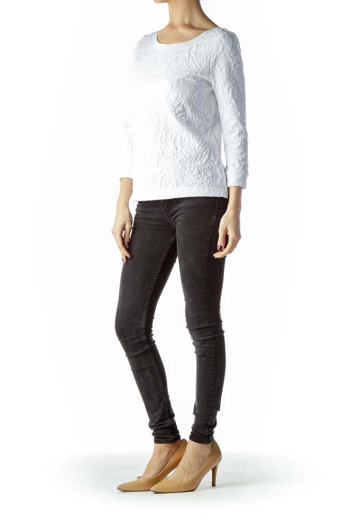 Front view of white textured Free People long sleeve top on model