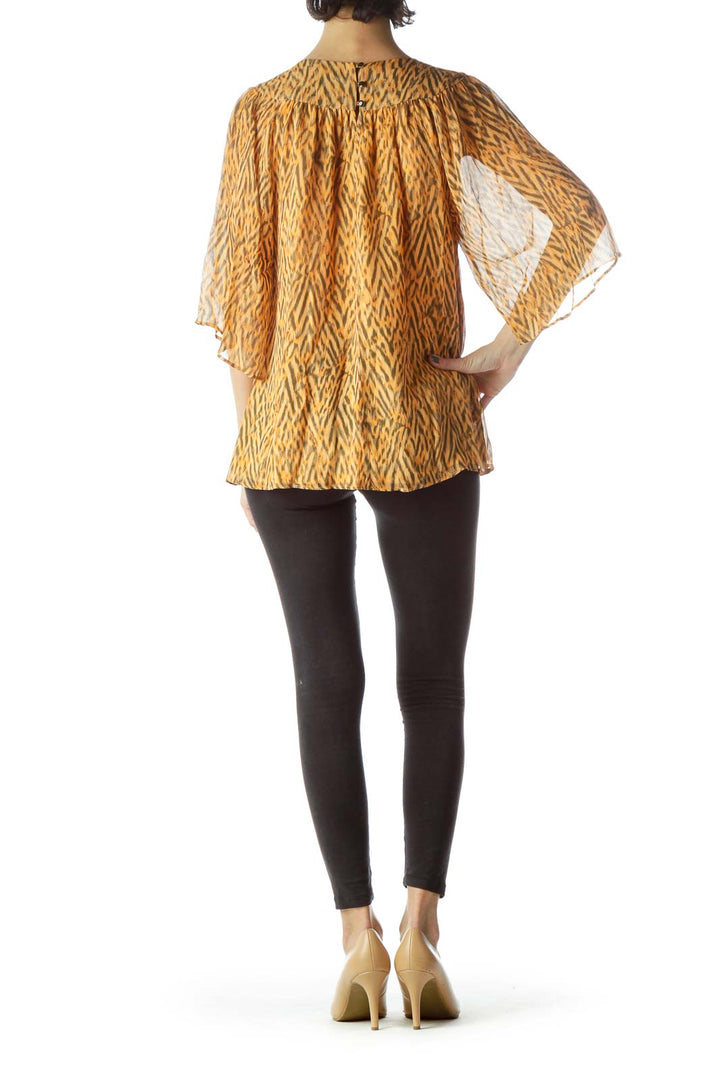 Orange Print Embellished Neck Flared Blouse