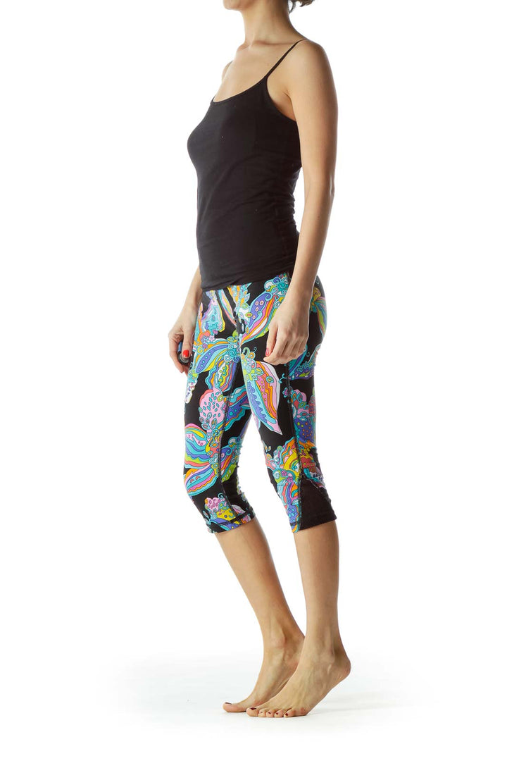 Front view of Trina Turk multicolor floral print capri leggings on model