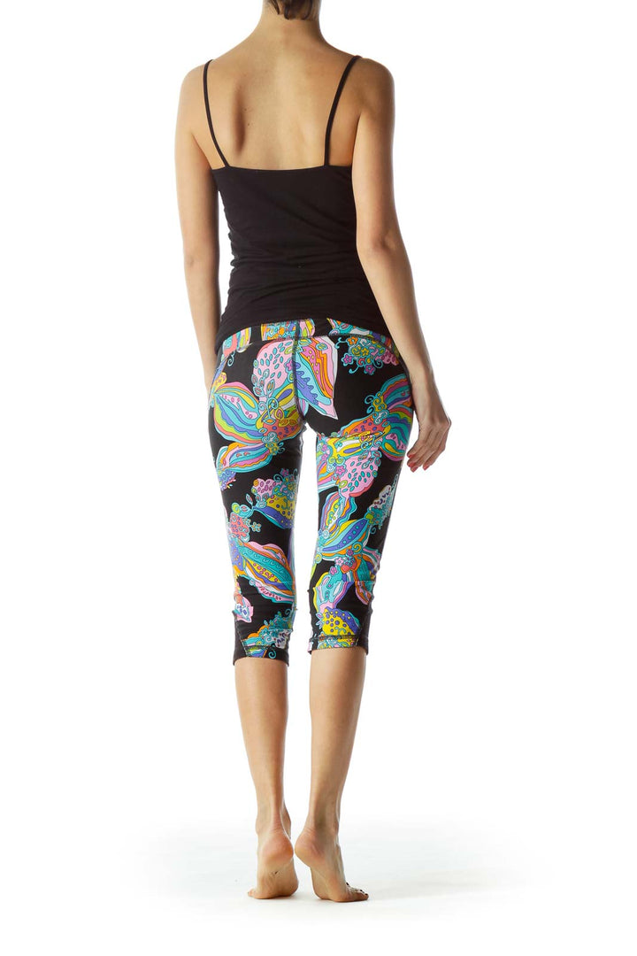 Back view of Trina Turk multicolor floral print capri leggings on model