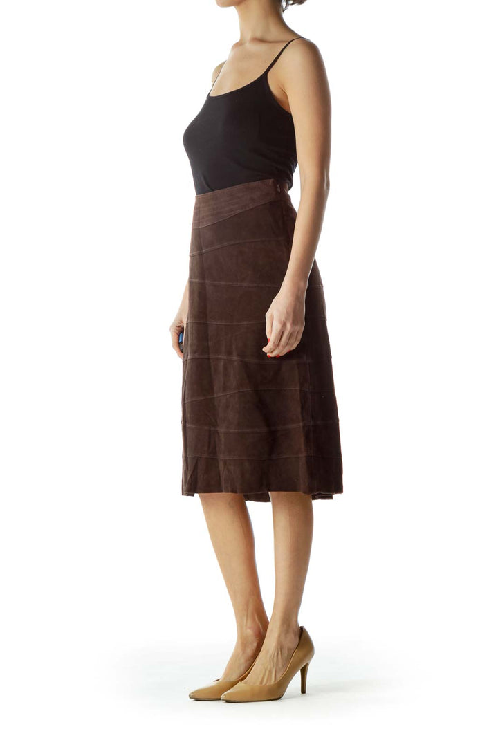 Front view of D.E.S. Studio brown suede A-line midi skirt