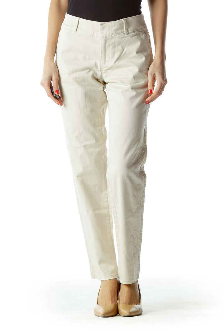 Front view of LOFT white straight-leg trousers on model