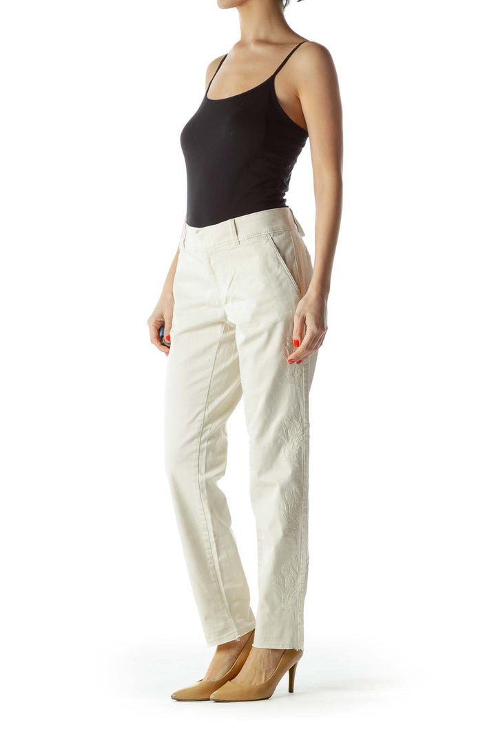 Front view of LOFT white straight-leg trousers on model