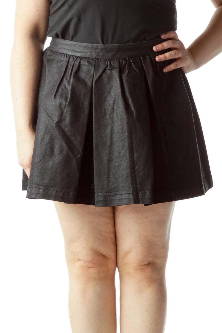 Front view of BCBGeneration black pleated mini skirt