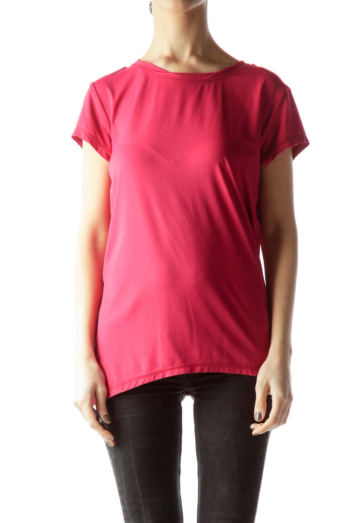 Front view of pink Alala athletic top with crew neck