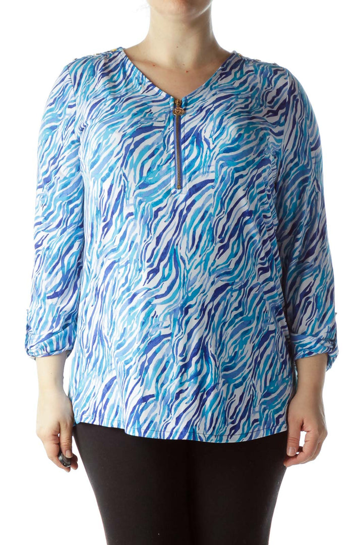 Front view of Anne Klein blue zebra print blouse with gold zipper