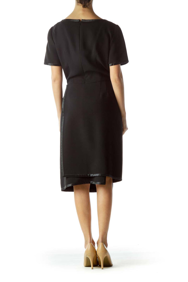 Back view of Bill Blass black cocktail dress showing clean lines and zipper closure