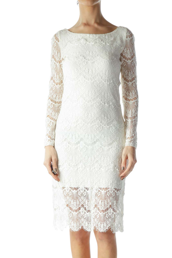 Front view of white lace long sleeve midi dress by BLAQUE LABEL