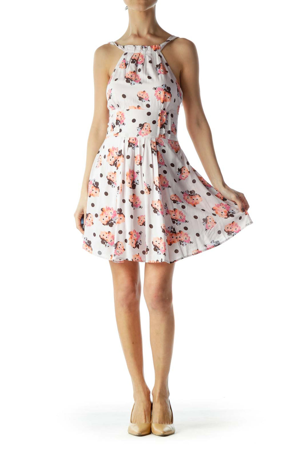 Front view of white halter dress with coral floral and brown polka dot print