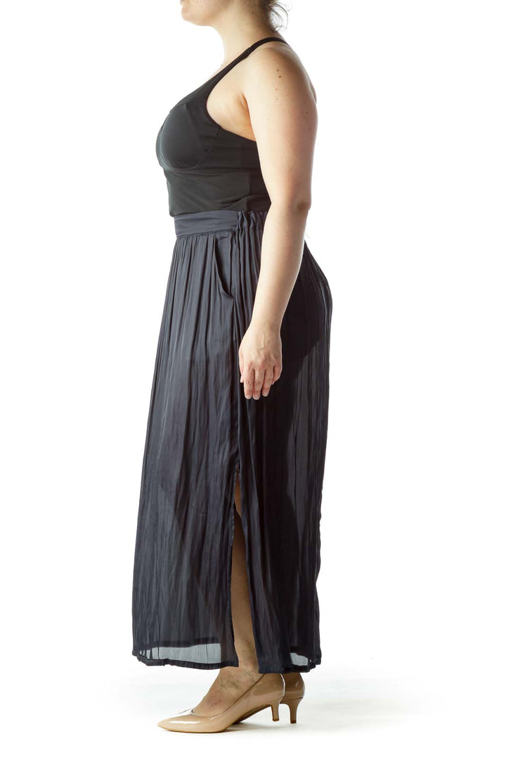 Front view of Lauren Vidal black pleated maxi skirt on model