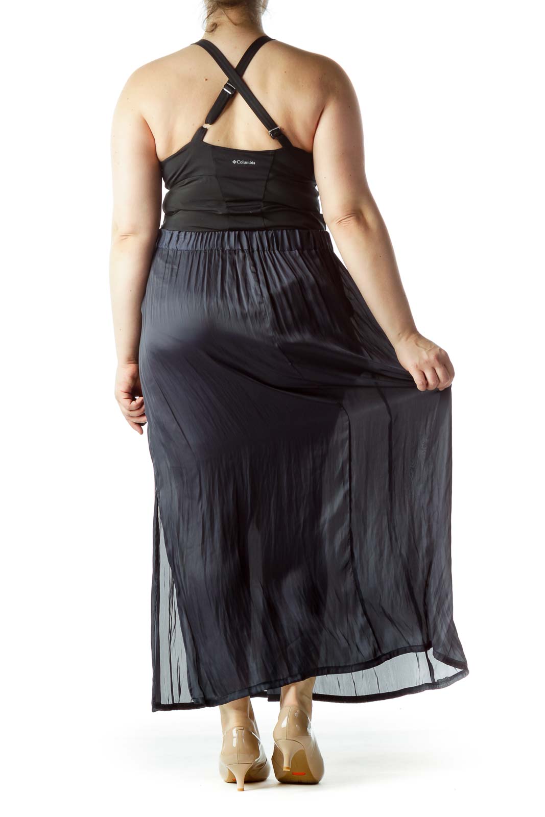 Back view of Lauren Vidal black pleated maxi skirt on model