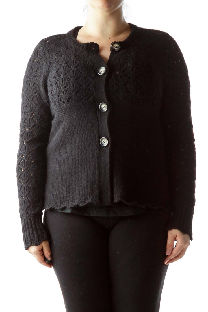 Front view of Juicy Couture black knit cardigan with lace pattern and silver buttons