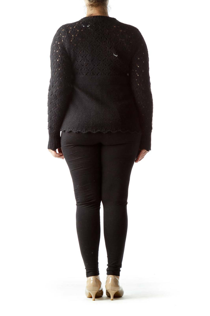 Back view of Juicy Couture black knit cardigan showing lace pattern detail