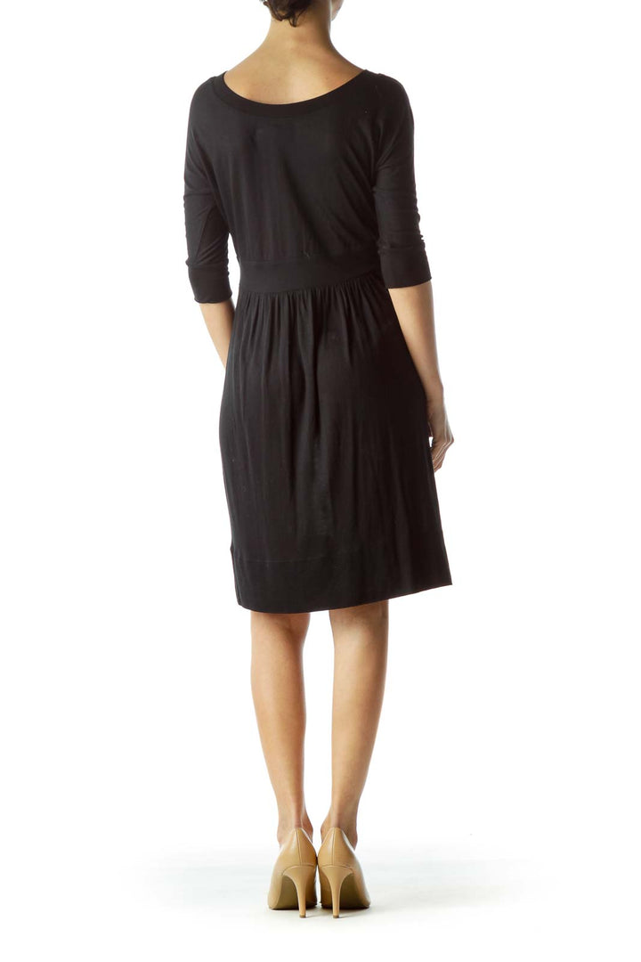 Back view of black Juicy Couture knee-length dress with 3/4 sleeves