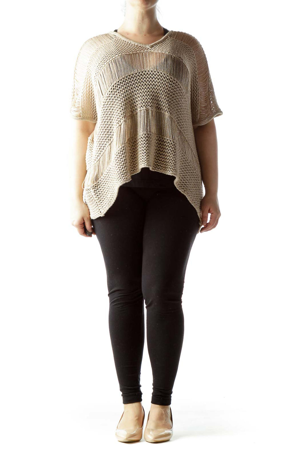 Front view of beige knitted poncho top with fringe details