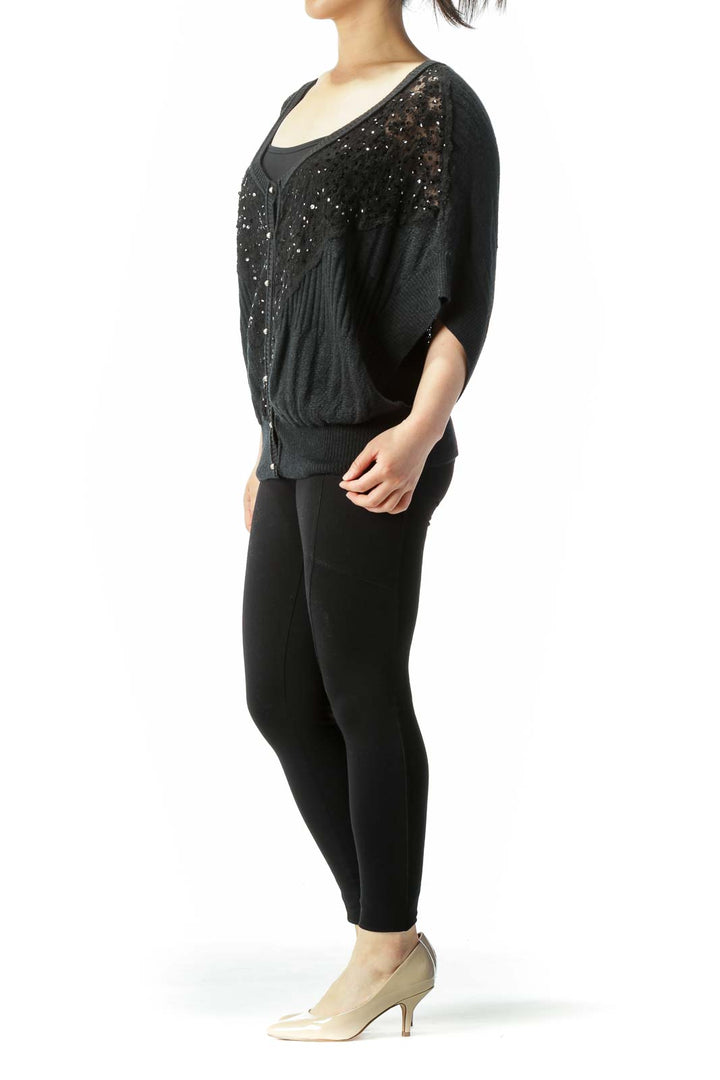 Front view of Free People black sequined batwing cardigan with button-front closure