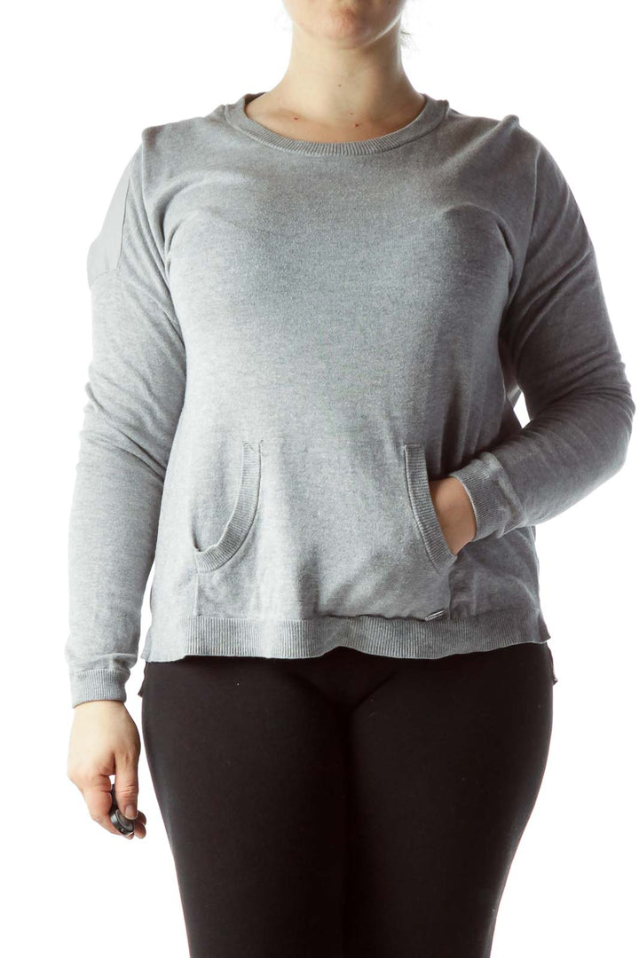 Front view of Calvin Klein gray long-sleeve crewneck sweater with front pockets