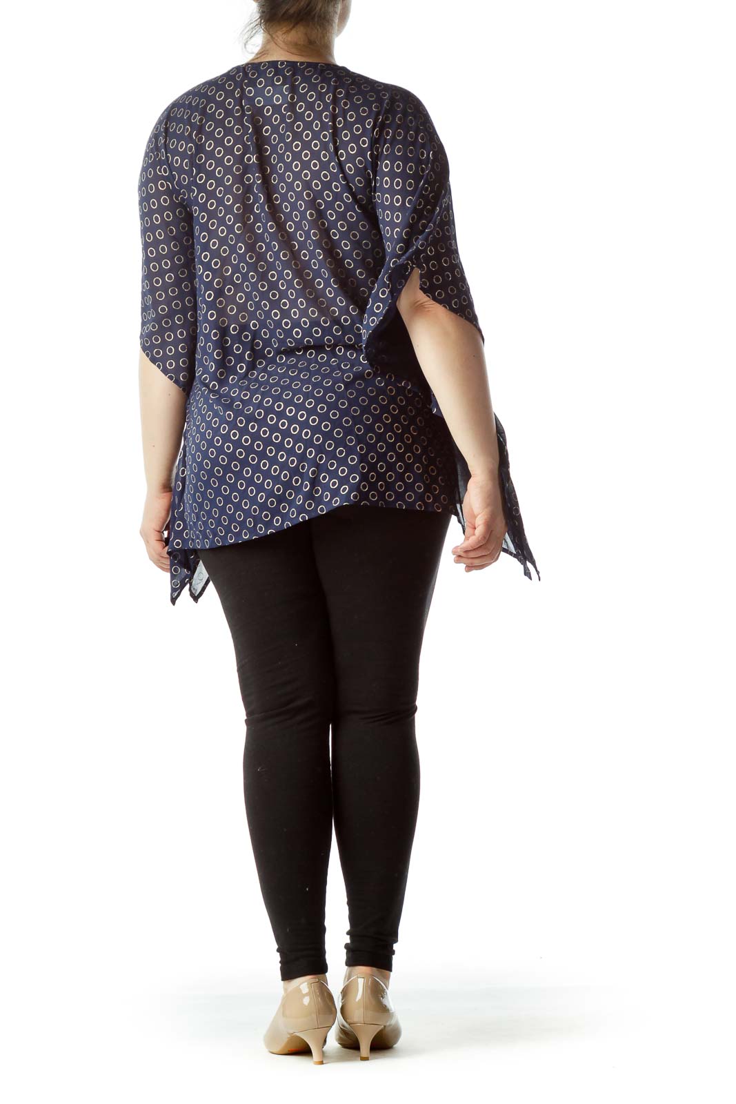 Back view of MICHAEL Michael Kors navy polka dot blouse showing flowy silhouette