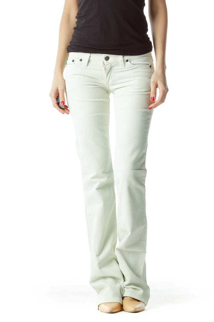 Front view of Grass LA white flared jeans on model