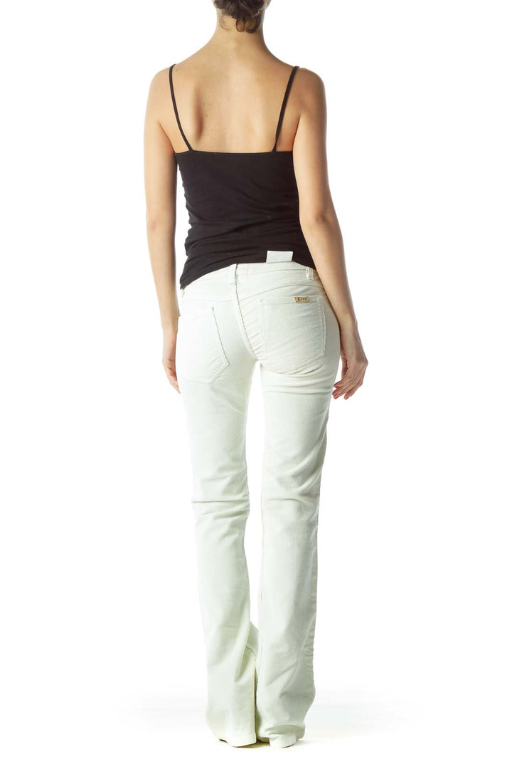 Back view of Grass LA white flared jeans on model