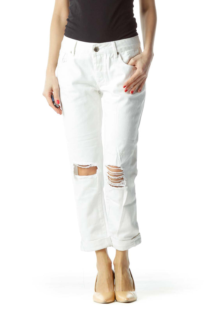 Front view of RACHEL Rachel Roy white distressed cropped denim jeans with knee rips