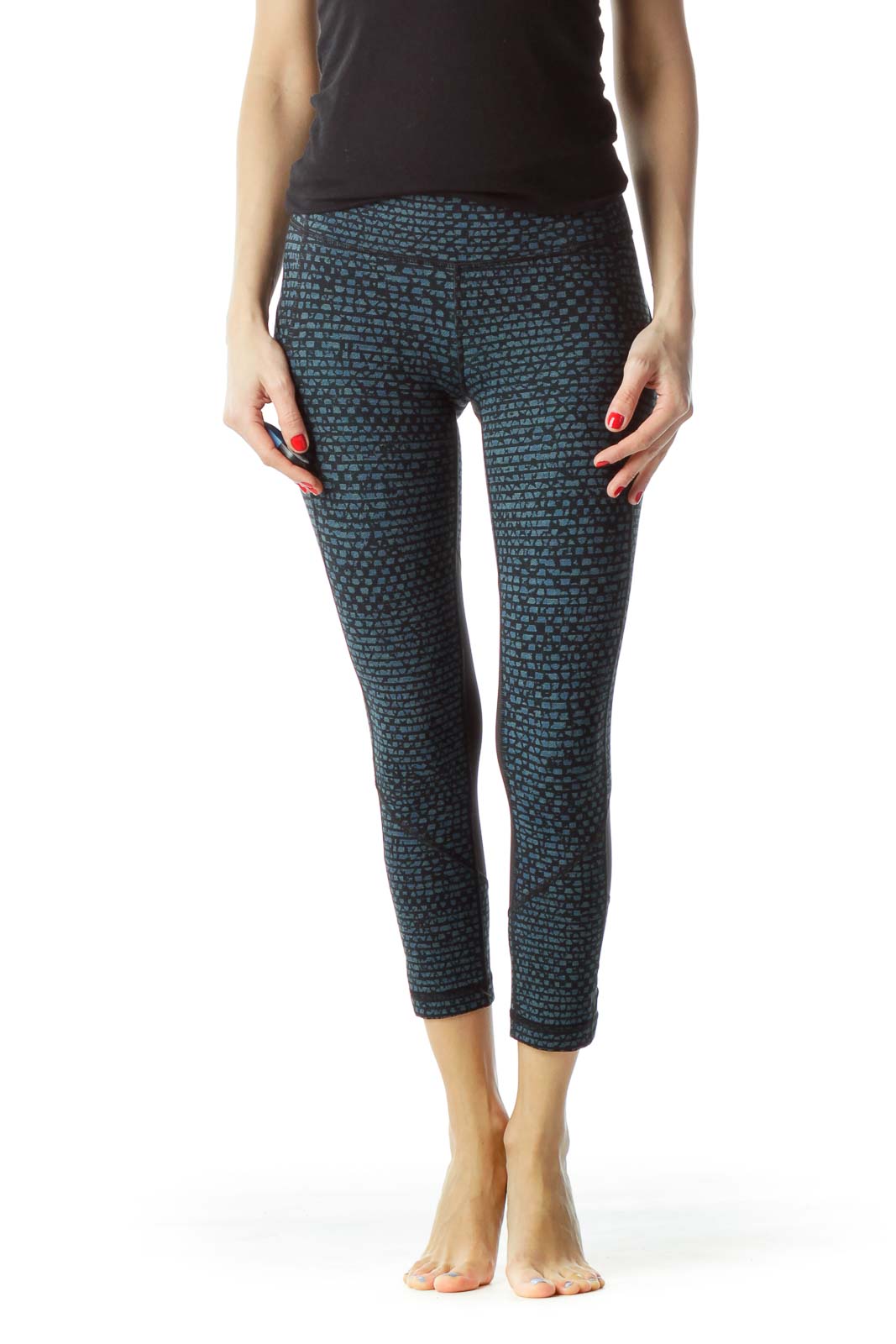 Front view of Lululemon blue patterned cropped leggings with black top