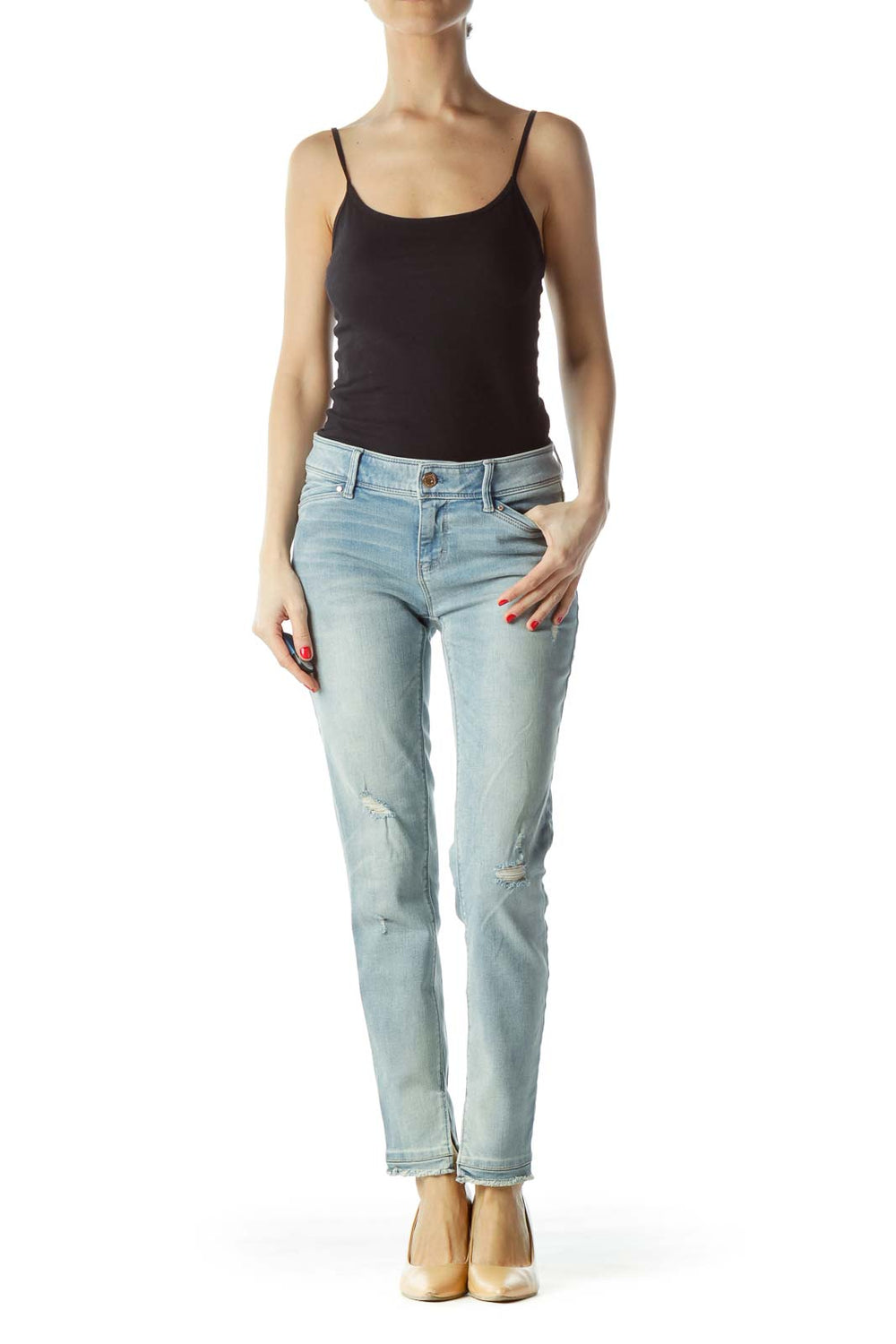 Front view of White House Black Market light blue distressed skinny jeans