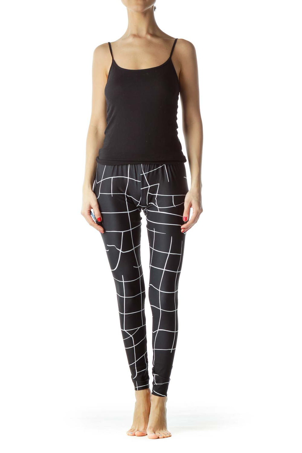 Front view of Puma black geometric print activewear leggings