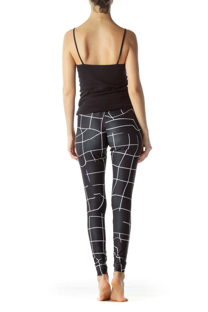 Back view of Puma black geometric print activewear leggings