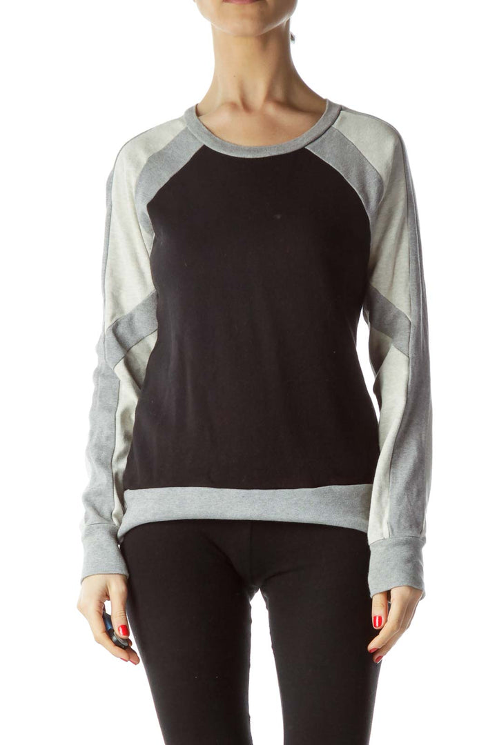 Front view of J.Crew black and gray colorblock raglan sweater